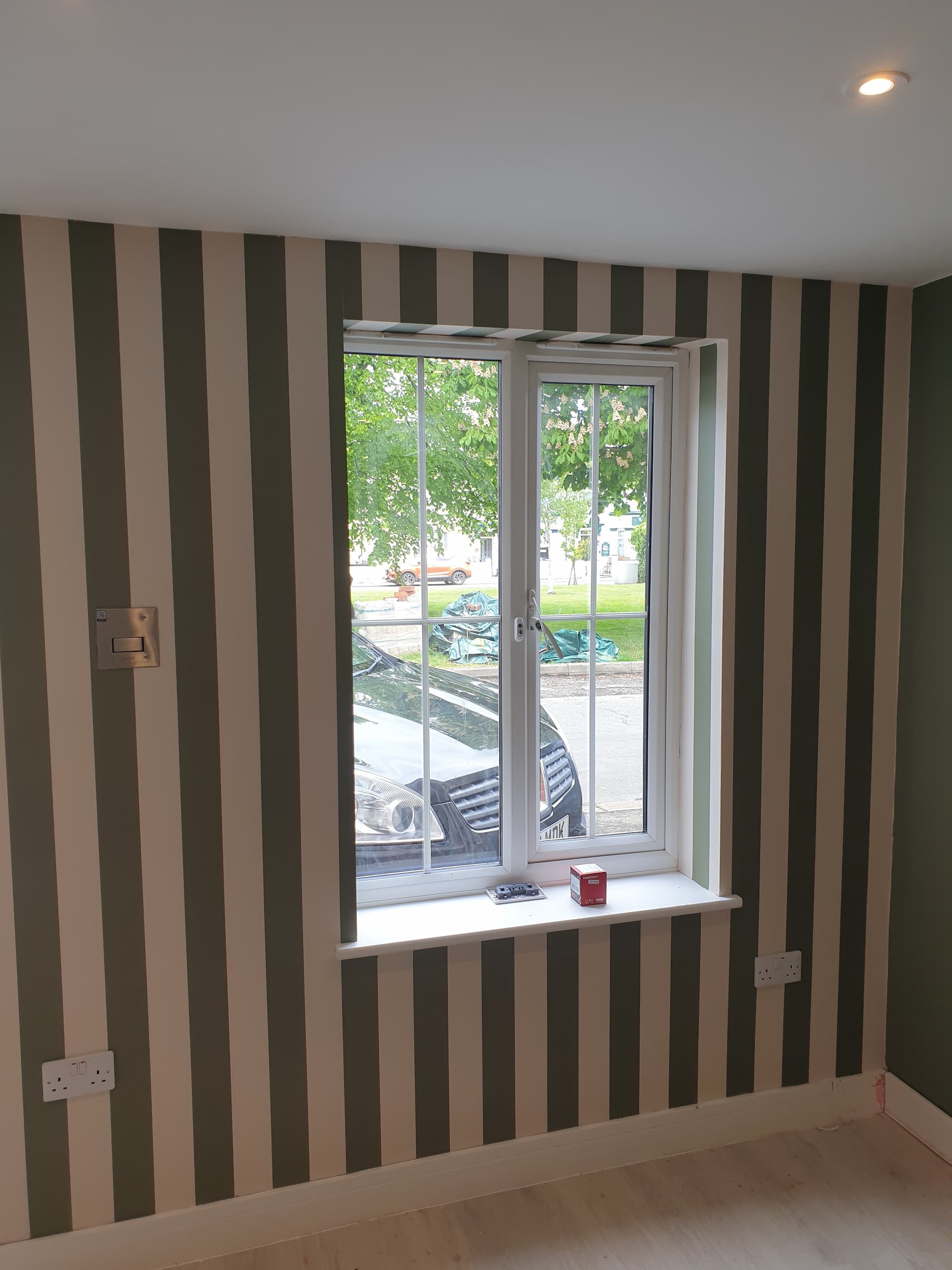 Freshly completed wallpapering with clean alignment and a smooth, even finish
