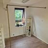 Wall and floor mounted brass corner clothes rail installed in a Norwich changing room