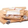 Unboxed furniture components shelf boards and internal hardware screws arranged neatly across a workspace prior to build