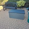Newly built weatherproof Easylife plastic utility chest with its lid down securely placed on a brick-weave patio surface