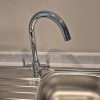 Brand new chrome Bristan mono kitchen mixer tap successfully replaced and polished to a shine on a stainless steel sink