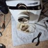 Saniflo macerator unit opened for inspection during a small plumbing job.