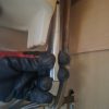 Progress shot inside a Spixworth utility cupboard showing copper pipes and tools under a white ceramic sink basin repair