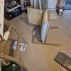Hemingford beige fabric and washed oak armchair with bobbin-style wooden frame, cushions and fixings laid out before assembly
