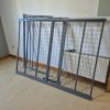 Flat pack metal bedstead framing panels structural steel tubes and fixing bolts neatly arranged before a reconstruction